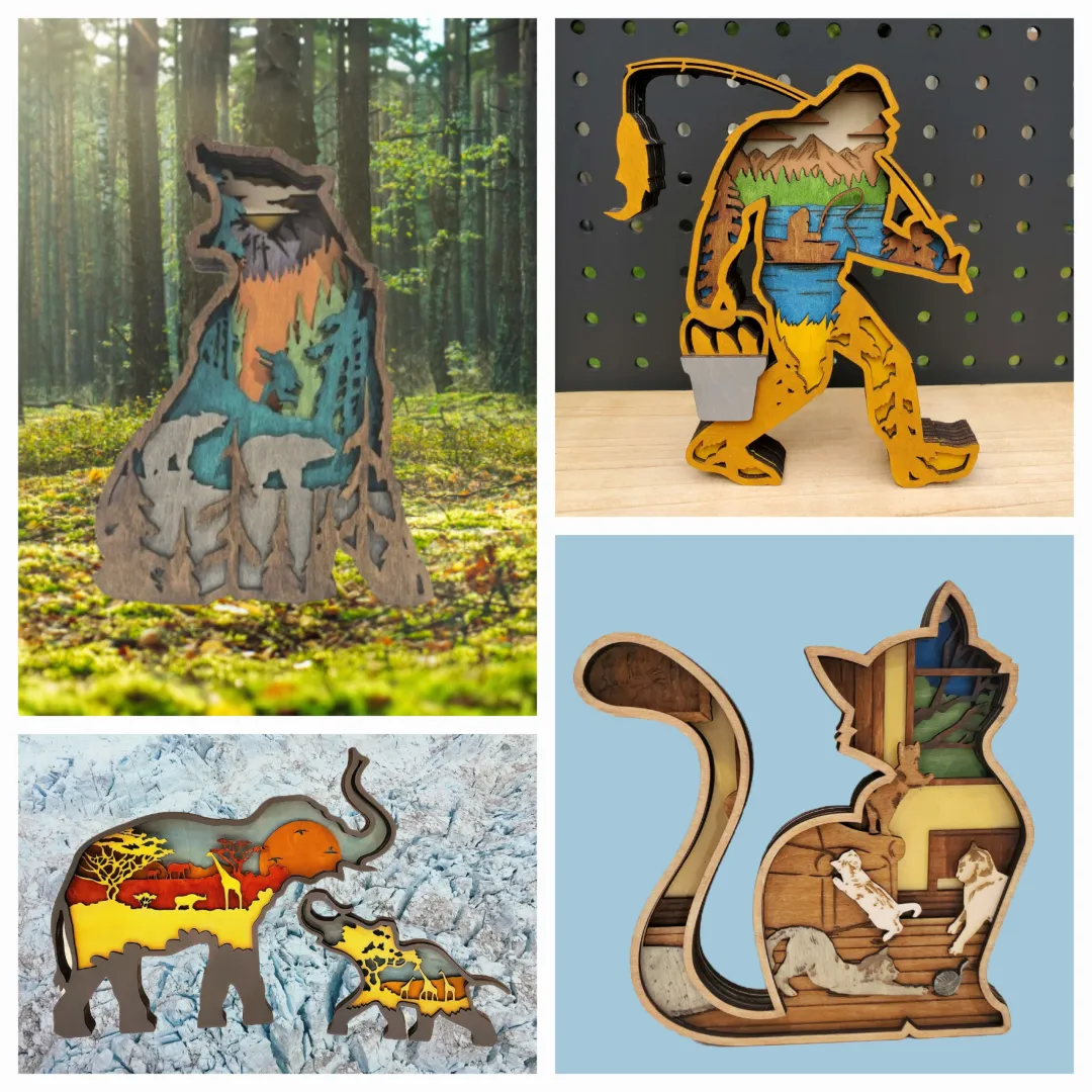 A collage of four 3D layered wood art designs: a bear silhouette containing a forest scene, a fishing Bigfoot, a cat silhouette with playing kittens inside, and an elephant family silhouetted against a savanna sunset.